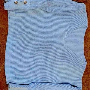 Light blue sweater, silver buttons on sleeves. Large, off shoulder.